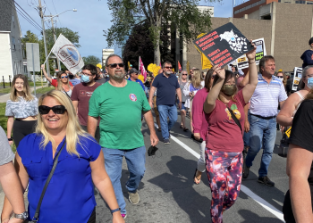 Hundreds march in 14 communities across New Brunswick in solidarity with front-line workers