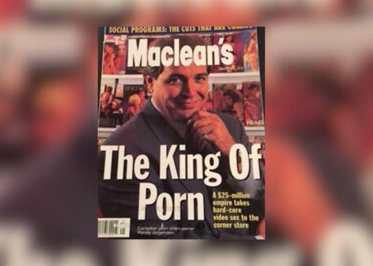 Maclean's magazine cover featuring Randy Jorgensen with the headline "The King of Porn" and a subheadline about his $25-million adult video empire. He is smiling, wearing a suit, with shelves of adult videos in the background.