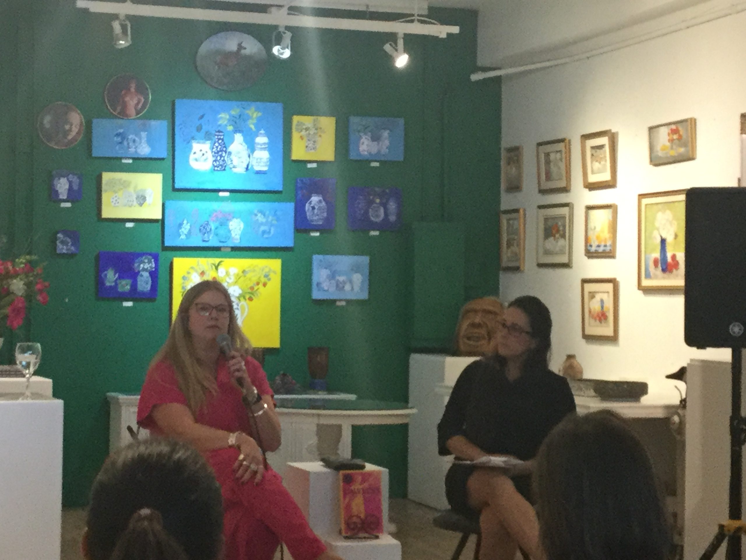 Martha Paynter speaking at the launch of her book Lawless in Fredericton on Sept. 20, with an audience of people seated in the gallery.